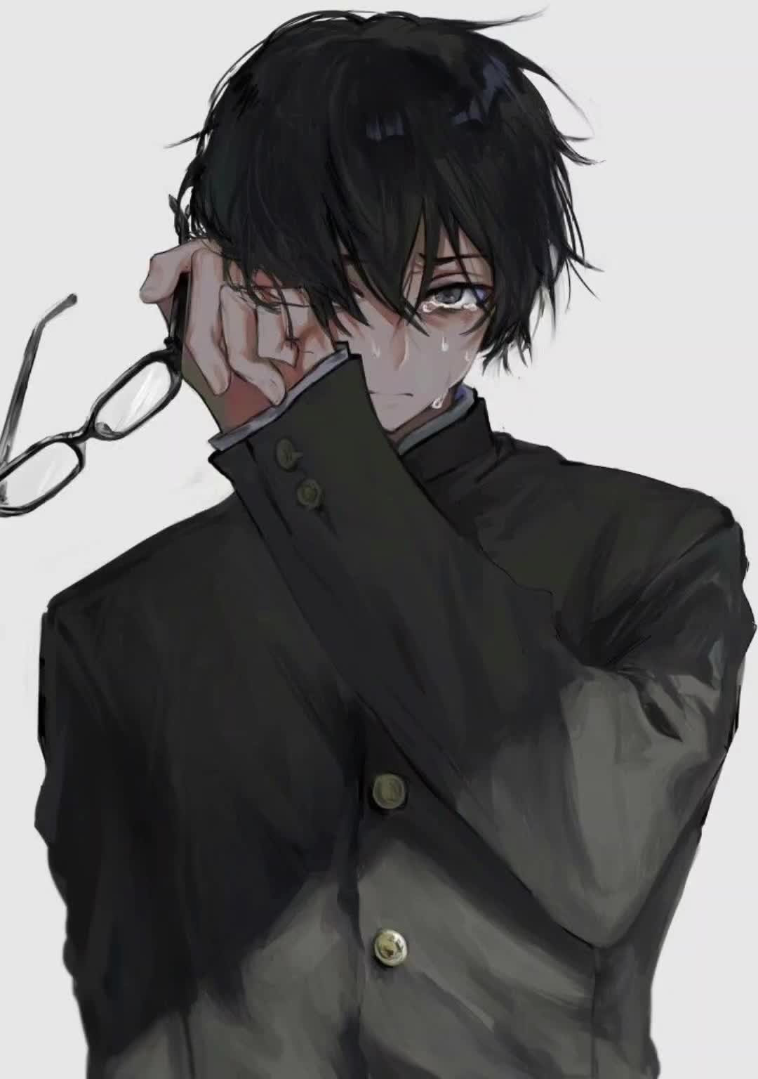 Chàng trai sadboiz đeo kính và lau nước mắt khi che mặt