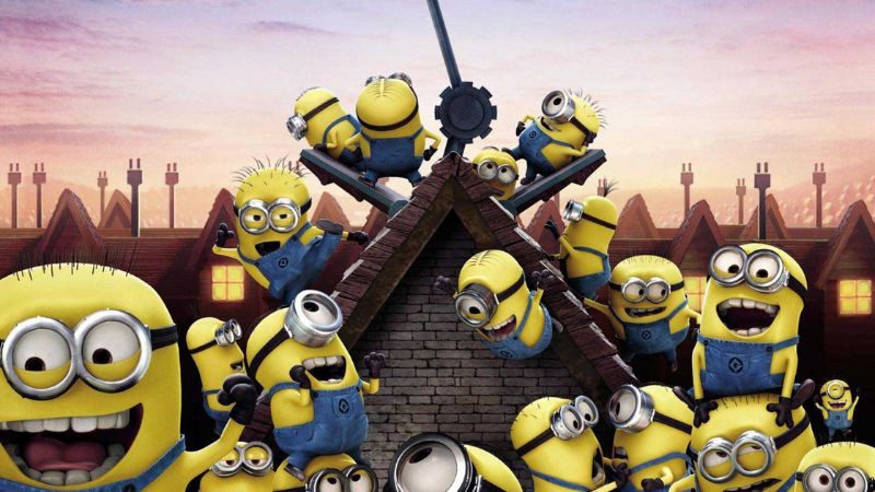 Chú Minion một mắt đeo kính bảo hộ và yếm bò đứng trên nền trắng